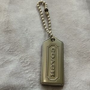 Coach small silver tone accessory